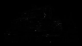 Dark silhouette of a city skyline with tall buildings and skyscrapers against a black background